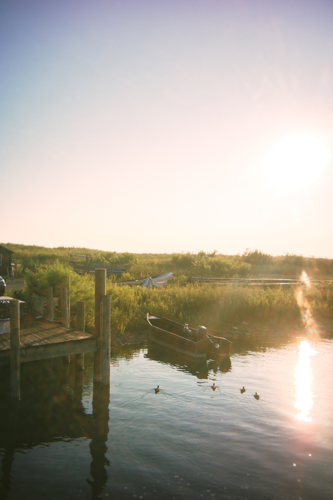 Photo of boat on water by a dock on an inland lake